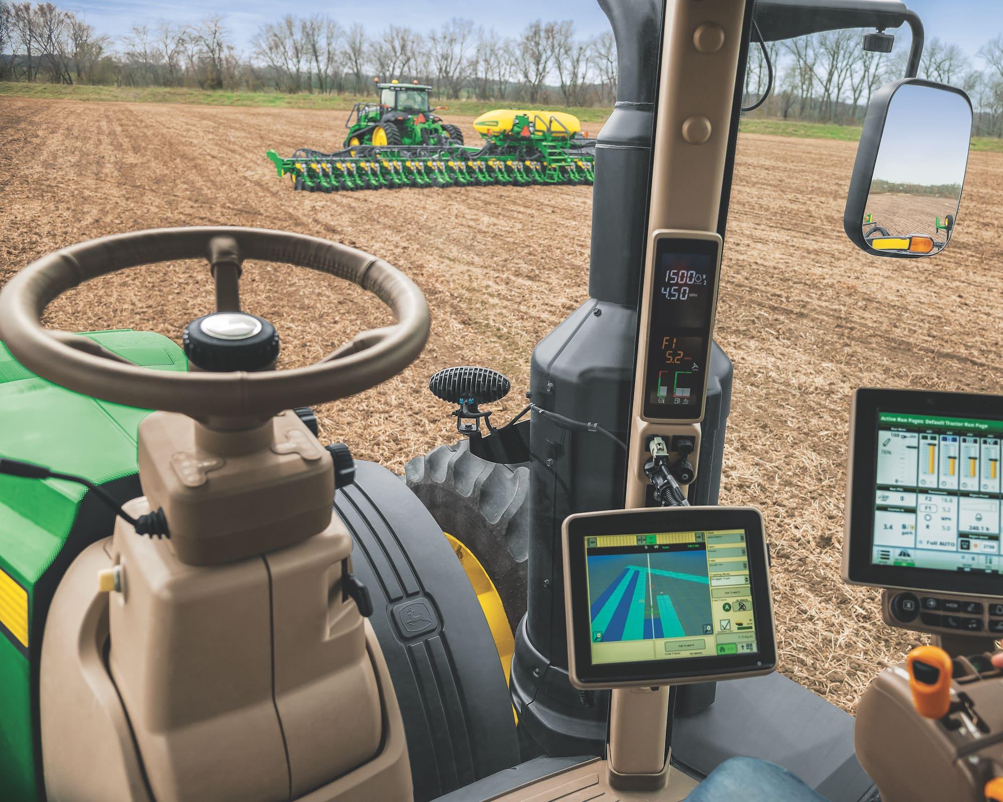 View from the drivers seat of a tractor plowing field