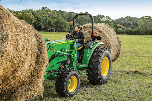 unnamed (10) compact tractor lifting round bale
